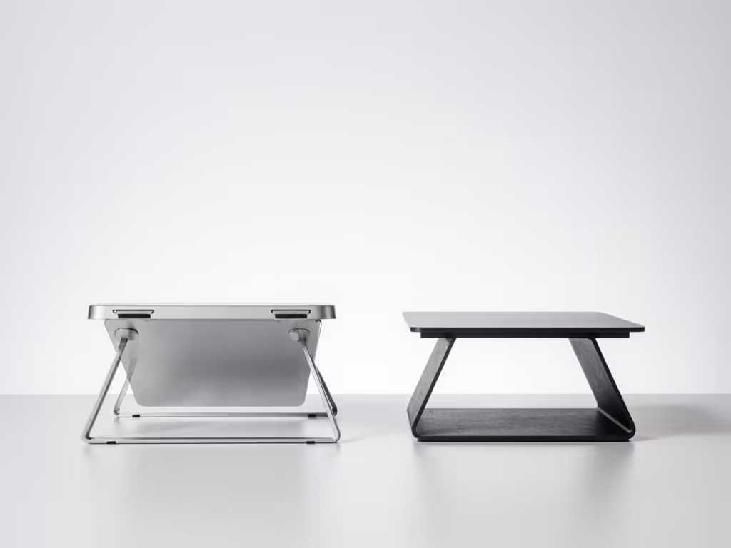 side-by-side_view_of_aluminum_versus_plastic_laptop_stand_bases_showing_footprint_width_and_stability_comparison