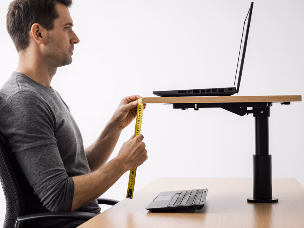 adult_measuring_seated_eye_height_with_tape_measure